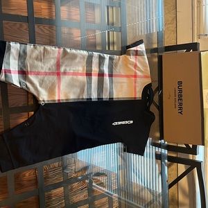 Burberry one piece Black and Tan color size 9months used one time only